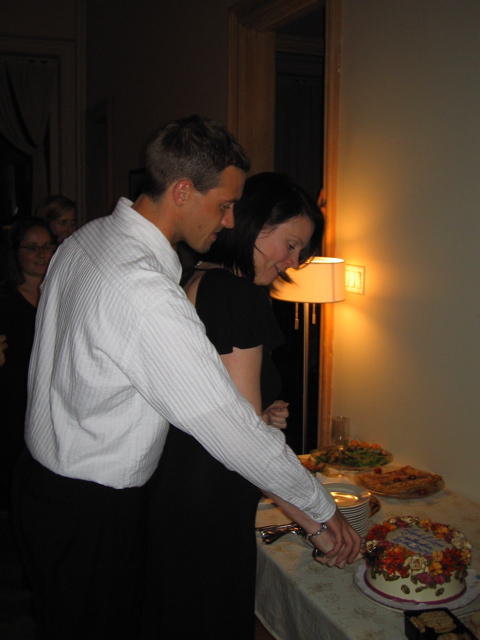 My husband and I cutting the cake